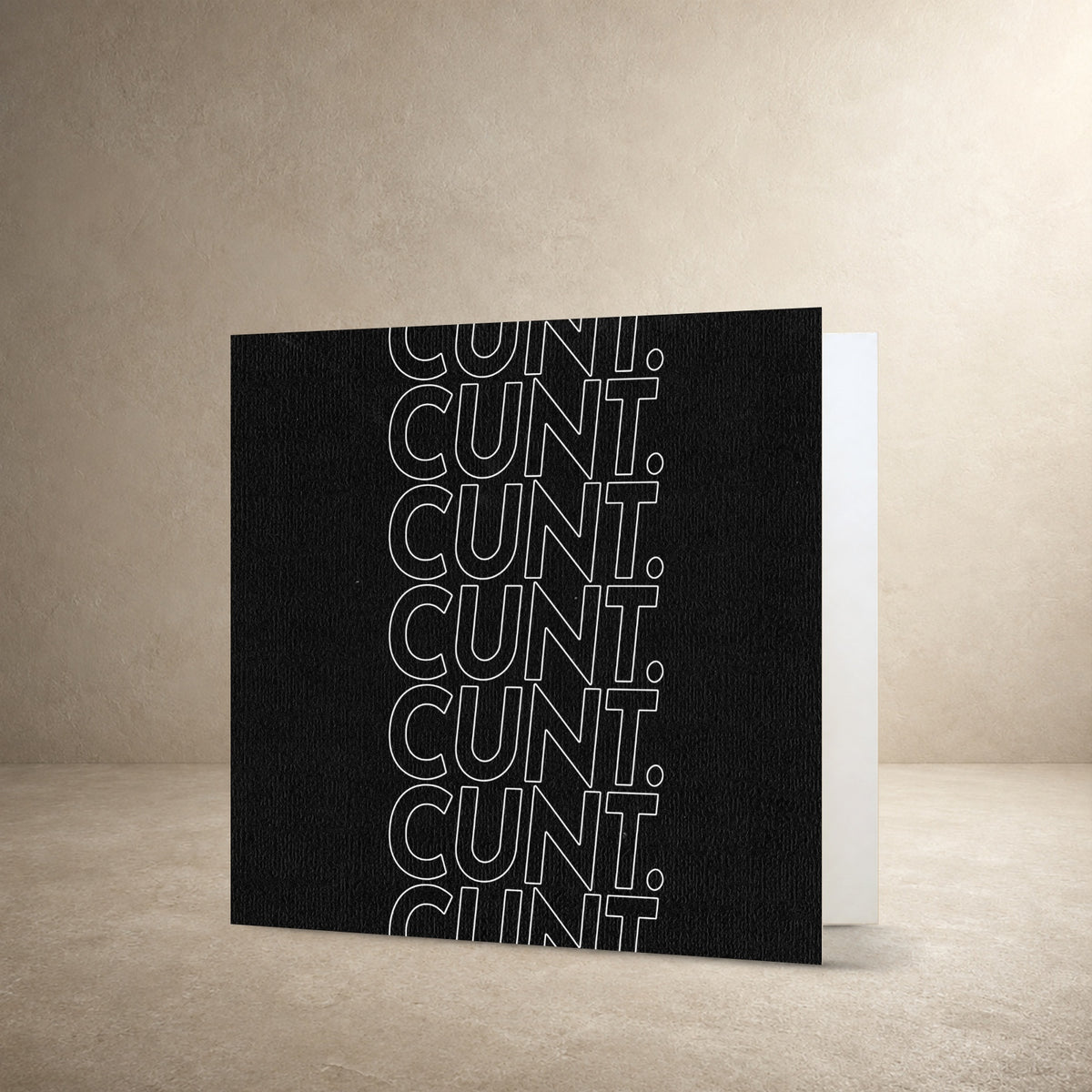 Black textured card front with repeating white outlined typography creating a striped pattern, with the message: “Cunt.”.