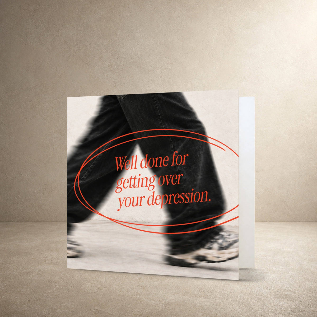 Black-and-white photograph of a person walking, overlaid with a hand-drawn red oval, with the message: “Well done for getting over your depression.”.