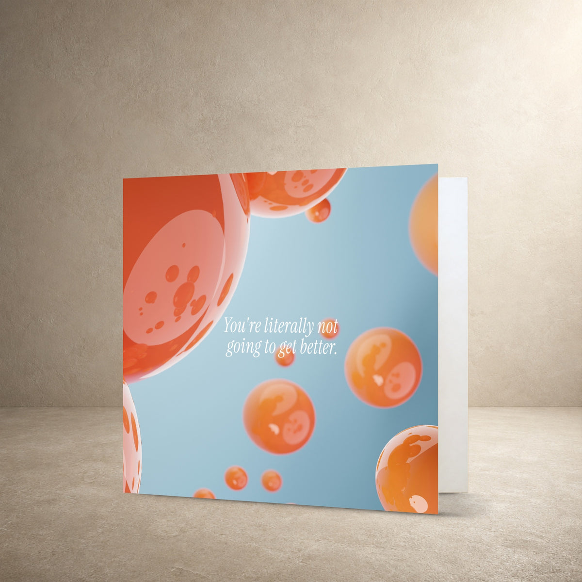 Light blue card front with floating translucent orange bubble-like shapes, with the message: “You're literally not going to get better.”.