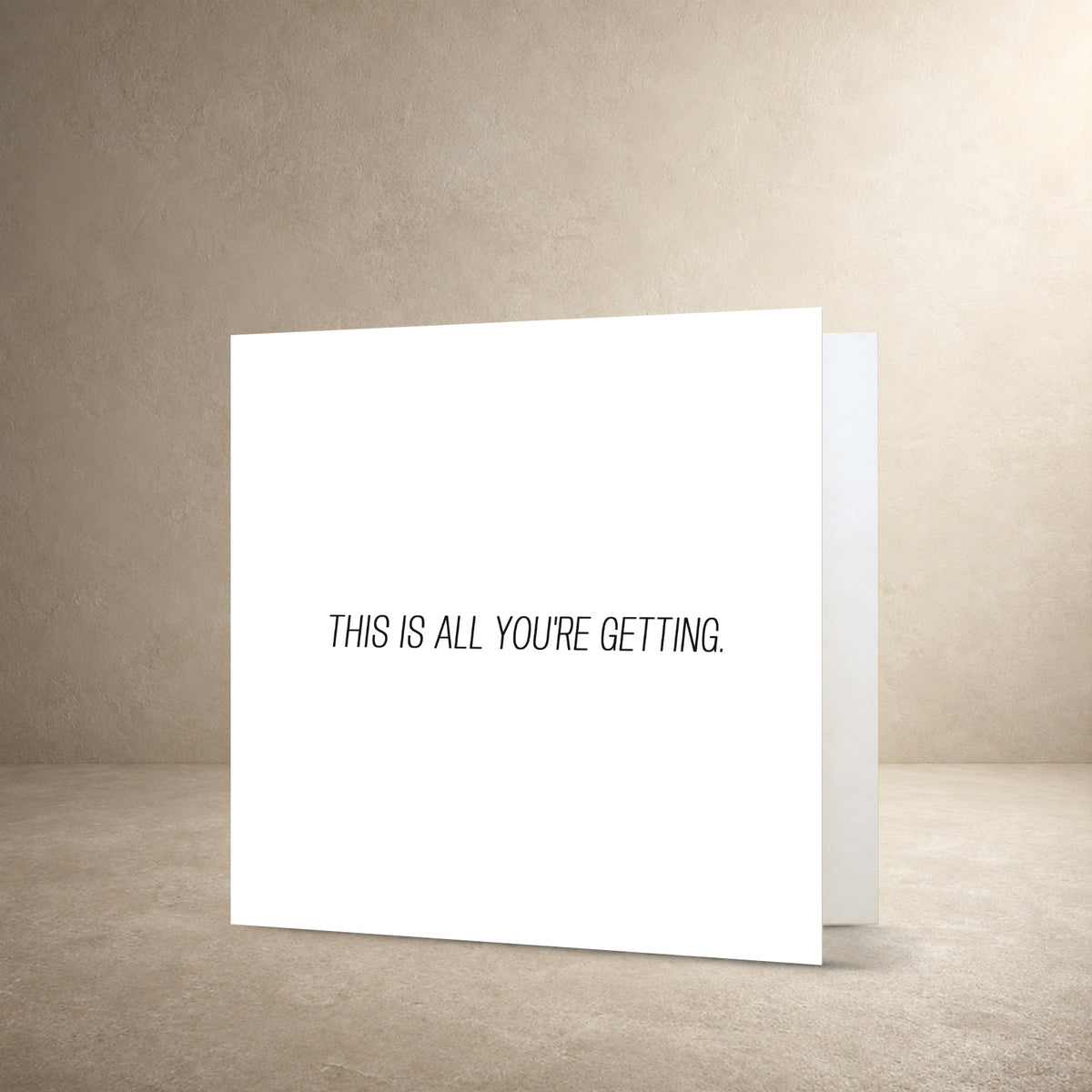 Minimal white card front with a small centred typographic layout, with the message: “This is all you're getting.”.